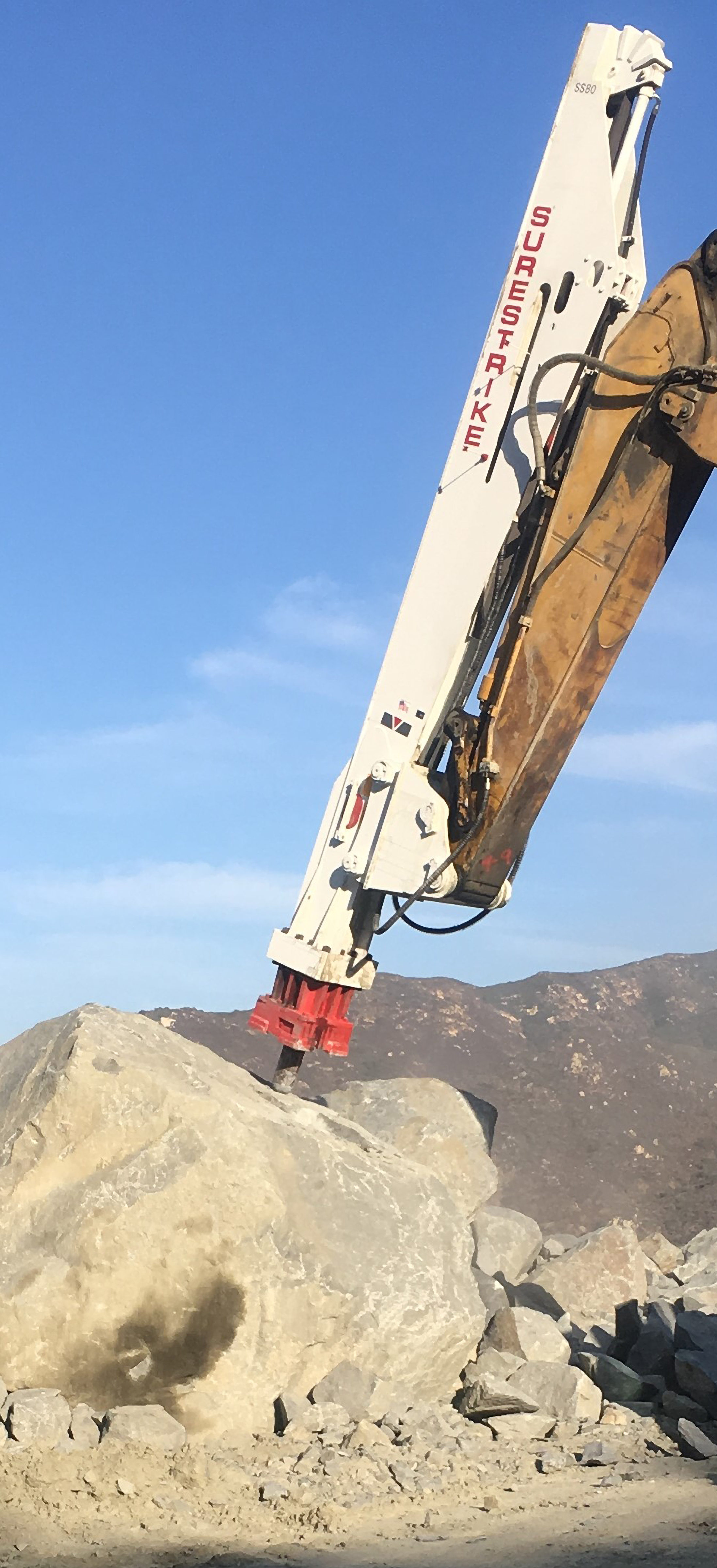 SS80 on CAT 385 Breaking Granite large